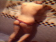 Русская проститутка позирует перед камерой и трогает свои груди